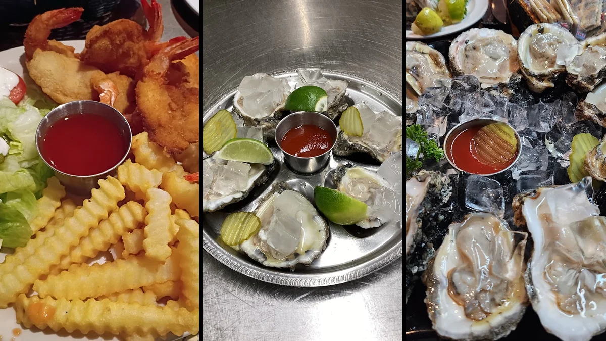 Plates of fried fish and oysters on display.